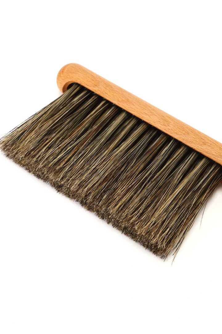 BRUSH WITH LEATHER STRINGS